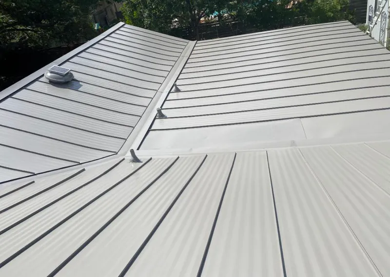 Solar attic fan installed on a metal roof for Roof Ventilation in Chadron